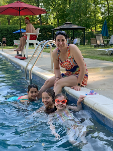 GMSC Vice President with children in the pool